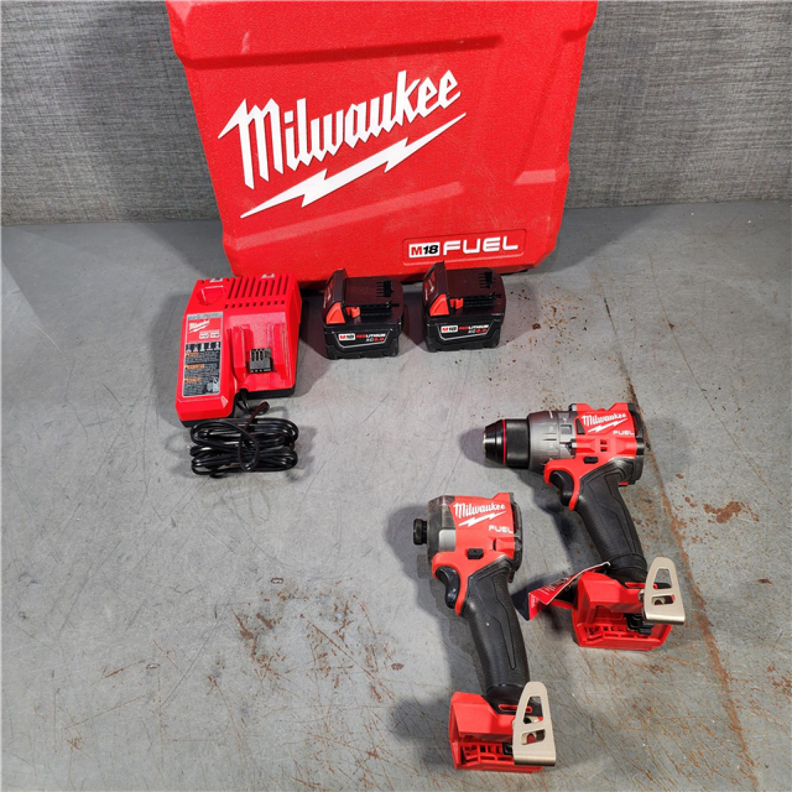 HOUSTON LOCATION - AS-IS Milwaukee M18 FUEL 18V Lithium-Ion Brushless Cordless Hammer Drill and Impact Driver Combo Kit (2-Tool) with 2 Batteries