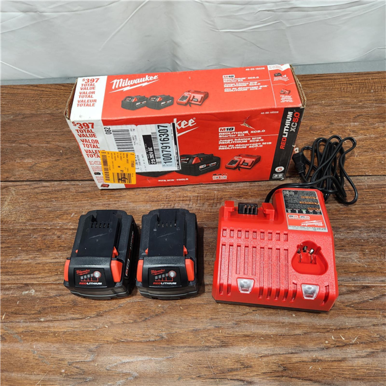 AS-IS Milwaukee M18 18-Volt Lithium-Ion XC Starter Kit with Two 5.0Ah Batteries / Charger (48-59-1852B)