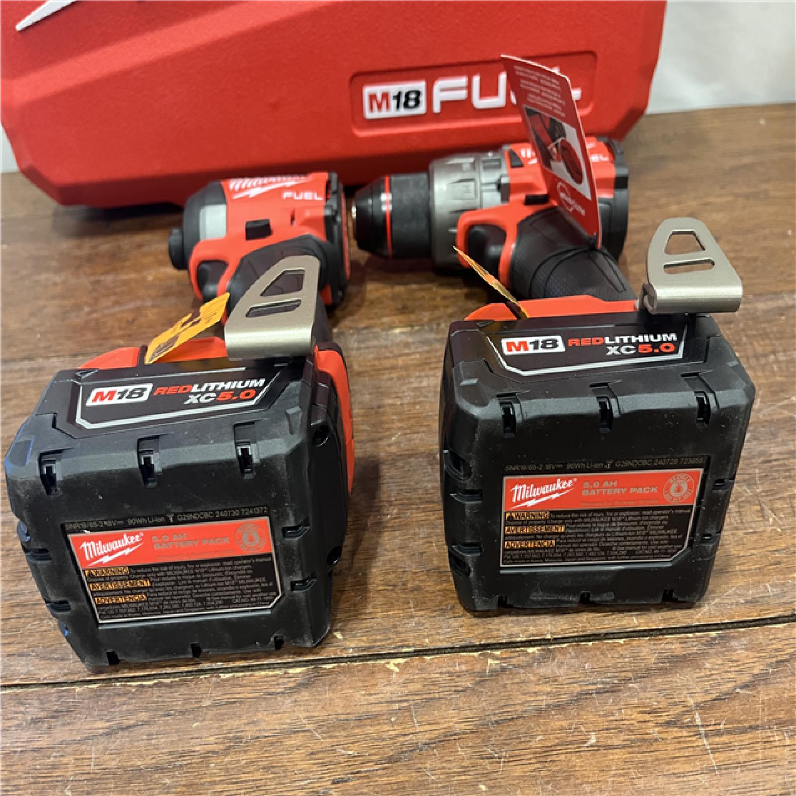 AS-ISMilwaukee M18 FUEL 18V Lithium-Ion Brushless Cordless Hammer Drill and Impact Driver Combo Kit (2-Tool) with 2 Batteries