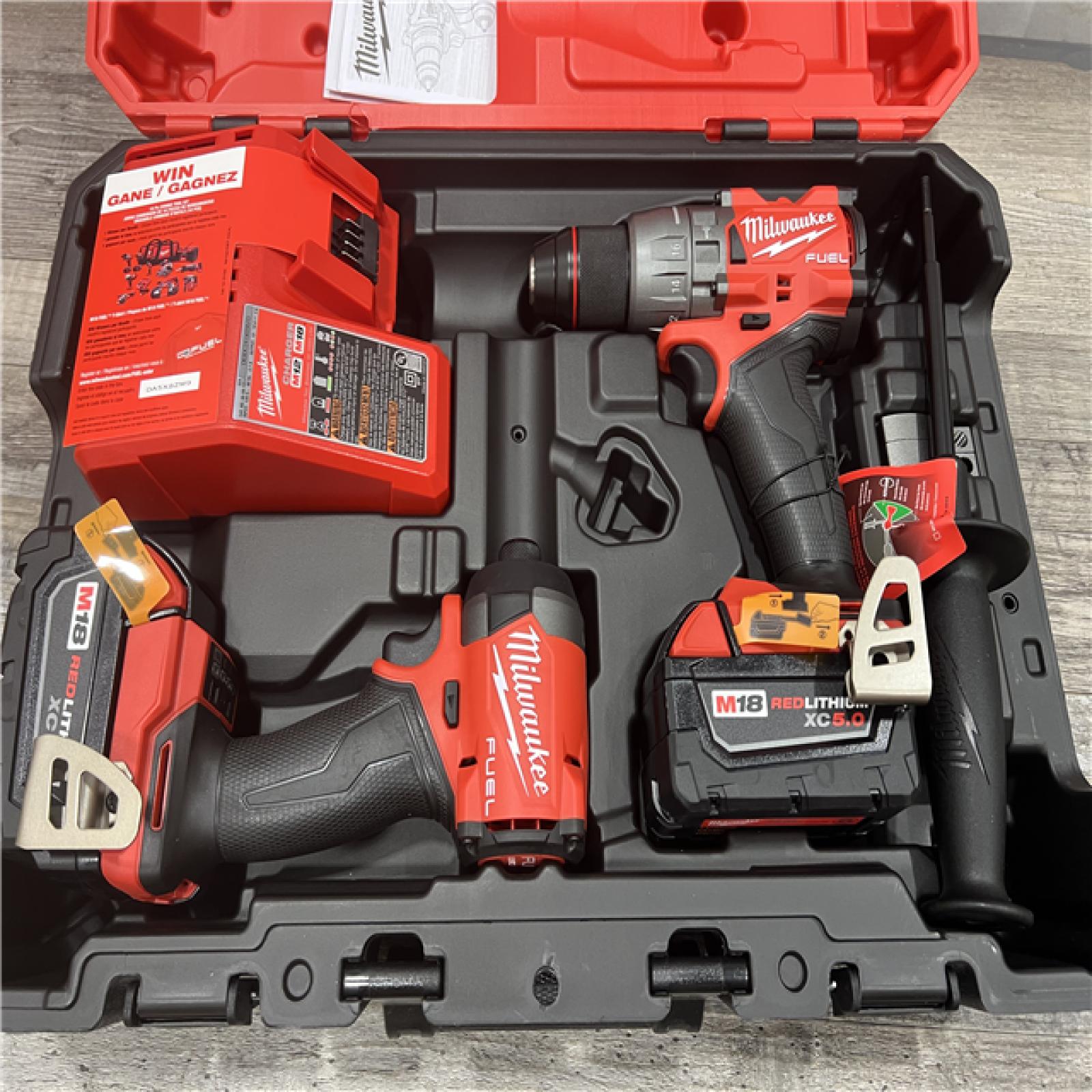 AS-IS MILWAUKEE M18 FUEL 18V Lithium-Ion Brushless Cordless Hammer Drill and Impact Driver Combo Kit (2-Tool) with 2 Batteries