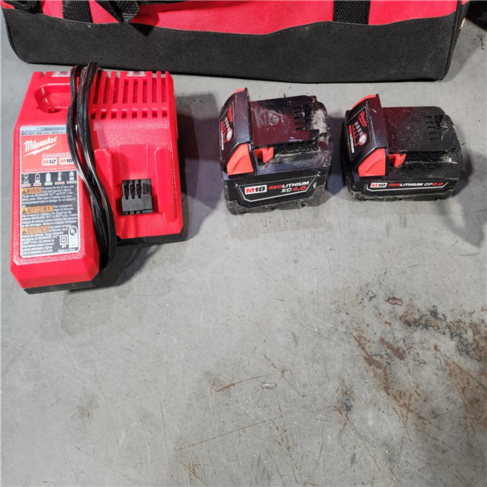 HOUSTON LOCATION - AS-IS Milwaukee M18 18-Volt Lithium-Ion Brushless Cordless Combo Kit (4-Tool) with 2-Batteries, 1-Charger and Tool Bag