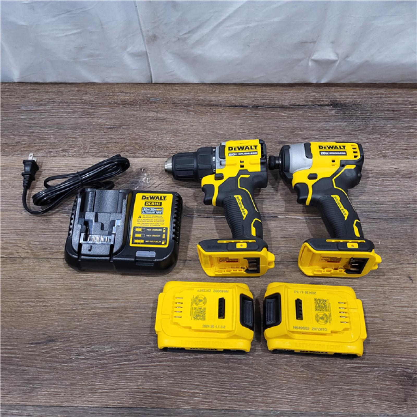 AS-IS DEWALT 20V MAX XR Hammer Drill and ATOMIC Impact Driver 2 Tool Cordless Combo Kit with (2) 4.0Ah Batteries, Charger, and Bag