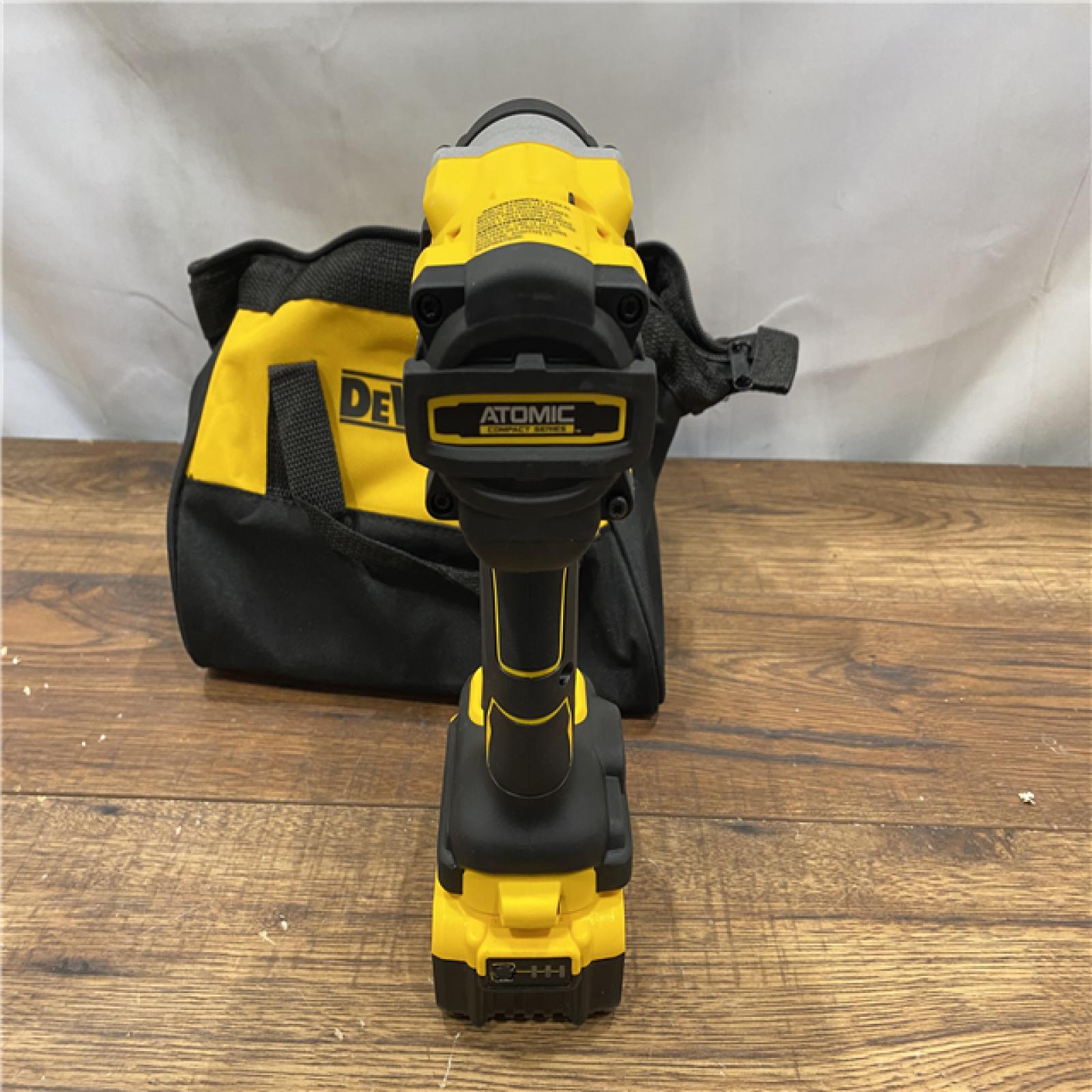 AS IS DEWALT ATOMIC 20V MAX Lithium-Ion Brushless Cordless 1/2 in. Variable Speed Impact Wrench Kit with 5 Ah Battery and Charger