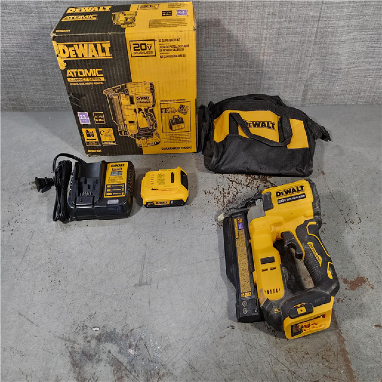 HOUSTON LOCATION - AS-IS DEWALT ATOMIC 20V MAX Lithium Ion Cordless 23 Gauge Pin Nailer Kit with 2.0Ah Battery and Charger