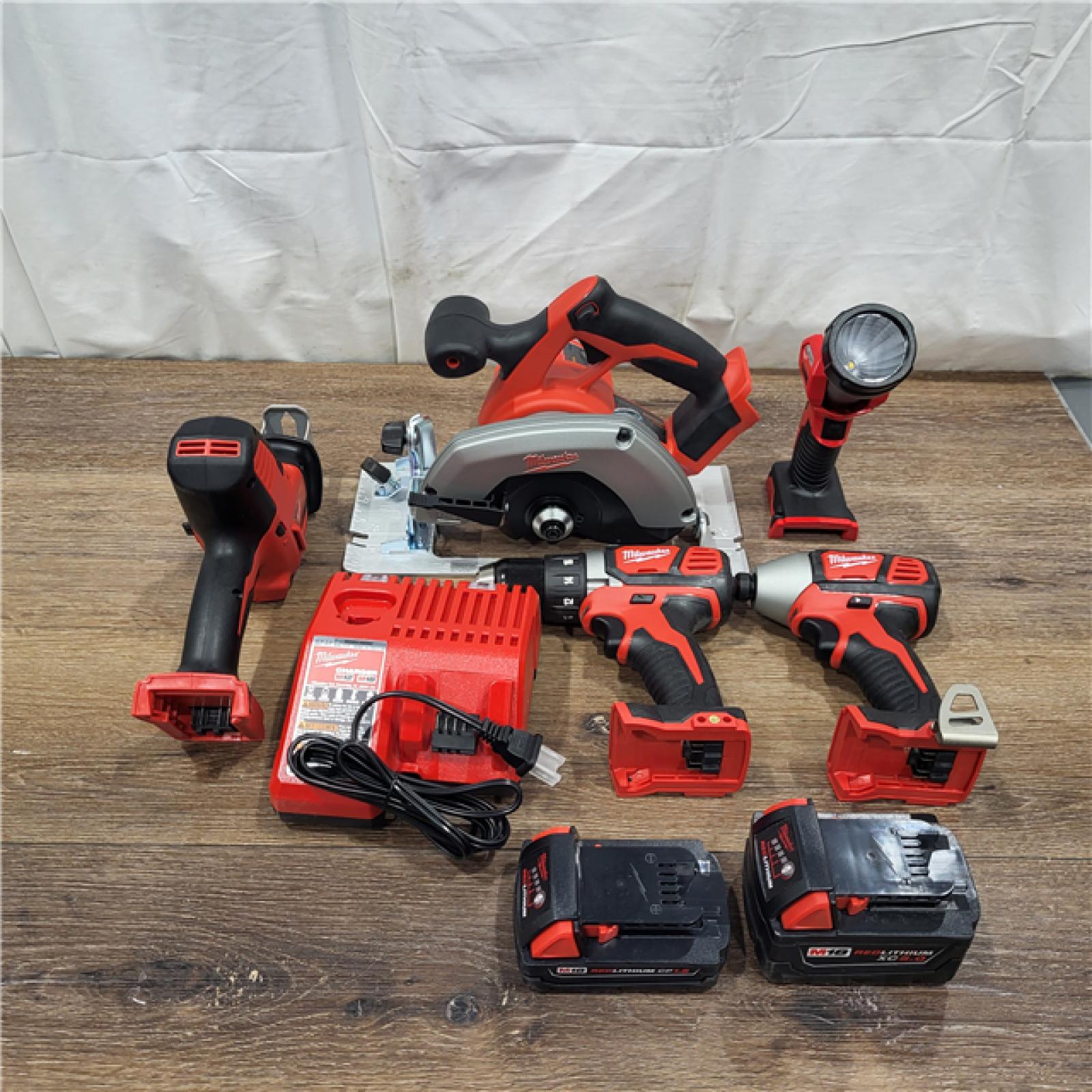 AS-IS Milwaukee M18 18-Volt Lithium-Ion Cordless Combo Tool Kit (5-Tool) with (1) 3.0Ah and (1) 1.5Ah Battery, (1) Charger, (1) Tool Bag