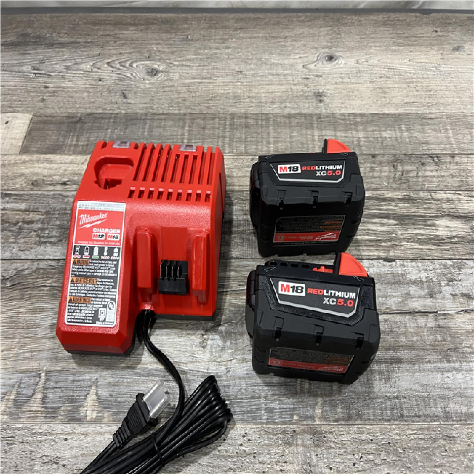 AS-IS Milwaukee M18 18-Volt Lithium-Ion XC Starter Kit with Two 5.0Ah Batteries / Charger (48-59-1852B)