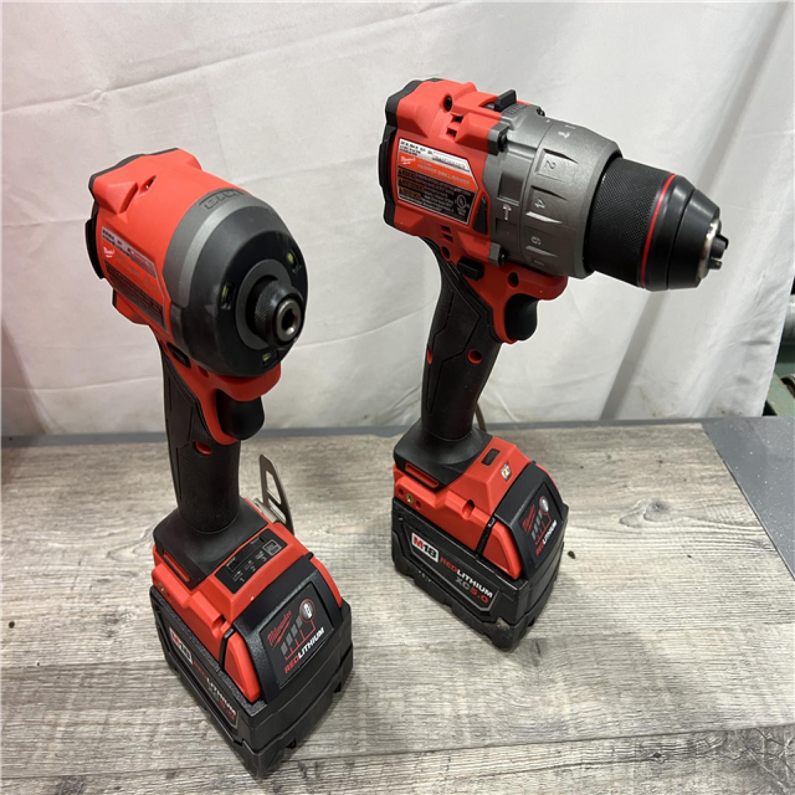 AS-IS Milwaukee M18 FUEL 18V Lithium-Ion Brushless Cordless Hammer Drill and Impact Driver Combo Kit (2-Tool) with 2 Batteries