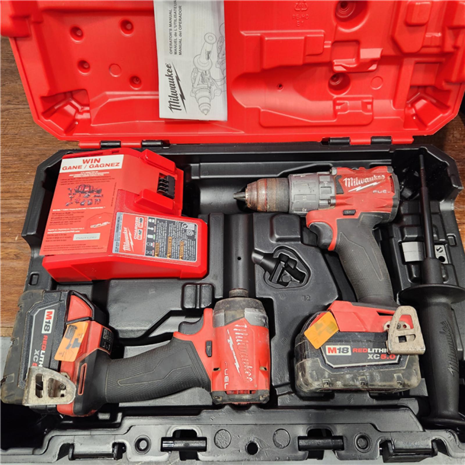 AS-IS Milwaukee M18 FUEL 18V Lithium-Ion Brushless Cordless Hammer Drill and Impact Driver Combo Kit (2-Tool) with 2 Batteries