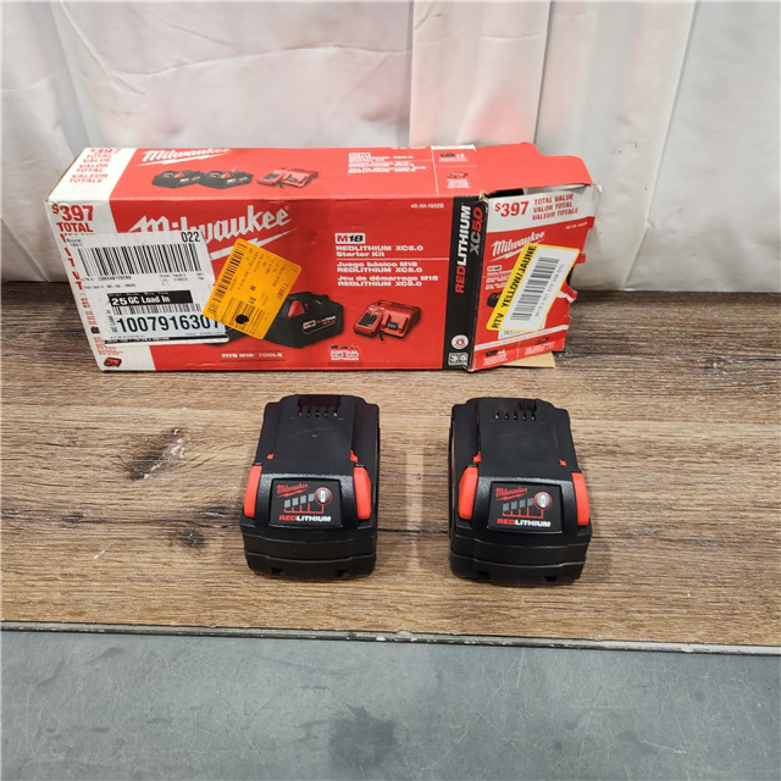 AS IS M18 18-Volt Lithium-Ion XC Starter Kit with Two 5.0Ah Batteries and Charger