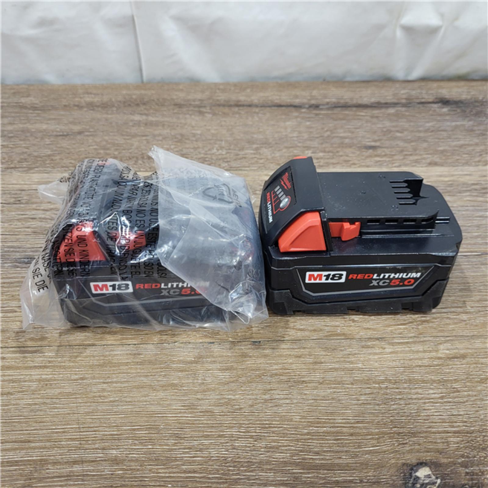 AS-IS Milwaukee M18 18-Volt Lithium-Ion XC Starter Kit with Two 5.0Ah Batteries / Charger (48-59-1852B)