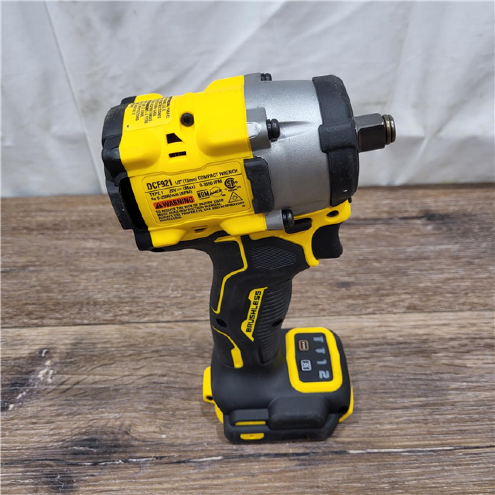 AS-IS DEWALT ATOMIC 20V MAX Lithium-Ion Brushless Cordless 1/2 in. Variable Speed Impact Wrench Kit with 5 Ah Battery and Charger