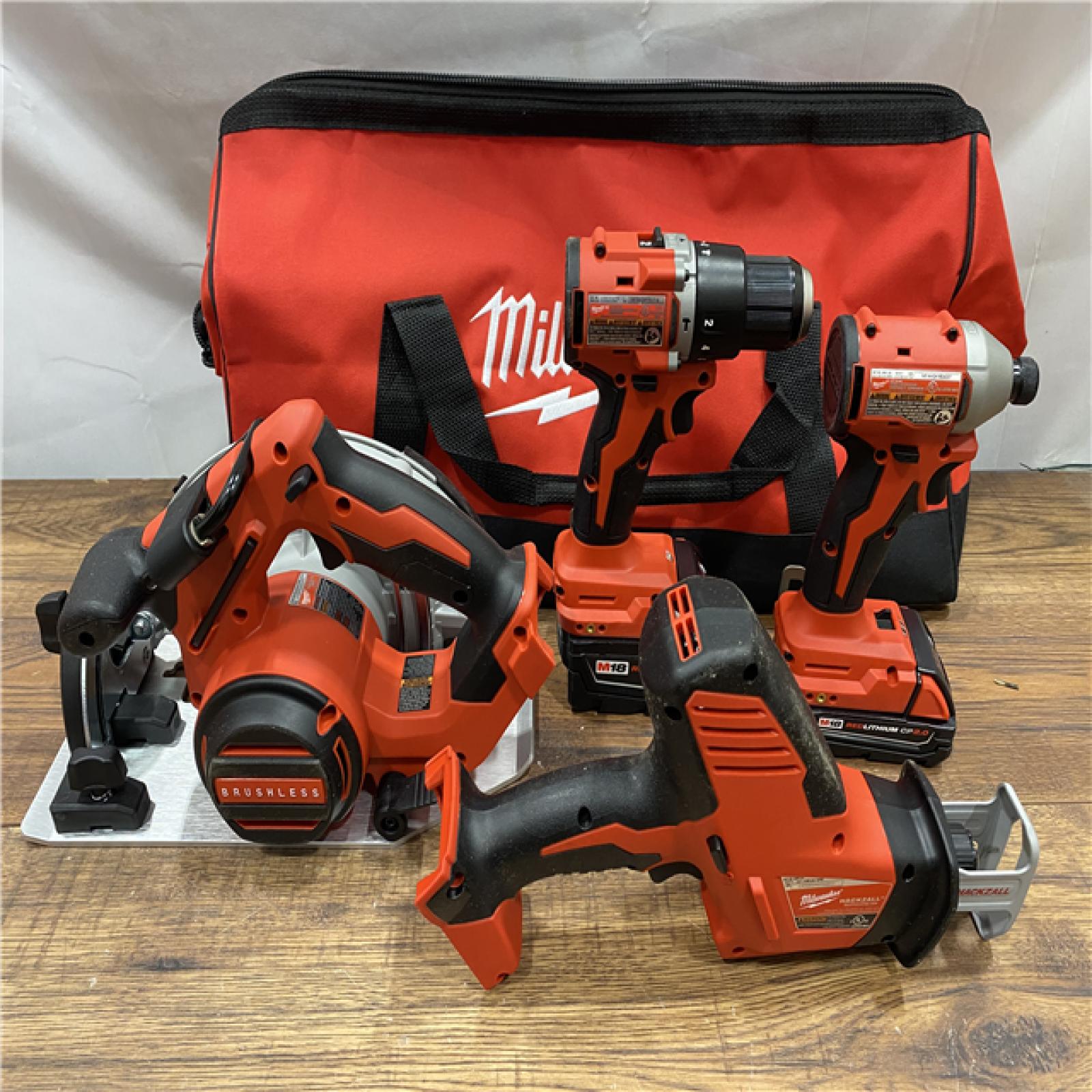 AS IS Milwaukee M18 18-Volt Lithium-Ion Brushless Cordless Combo Kit (4-Tool) with 2-Batteries, 1-Charger and Tool Bag