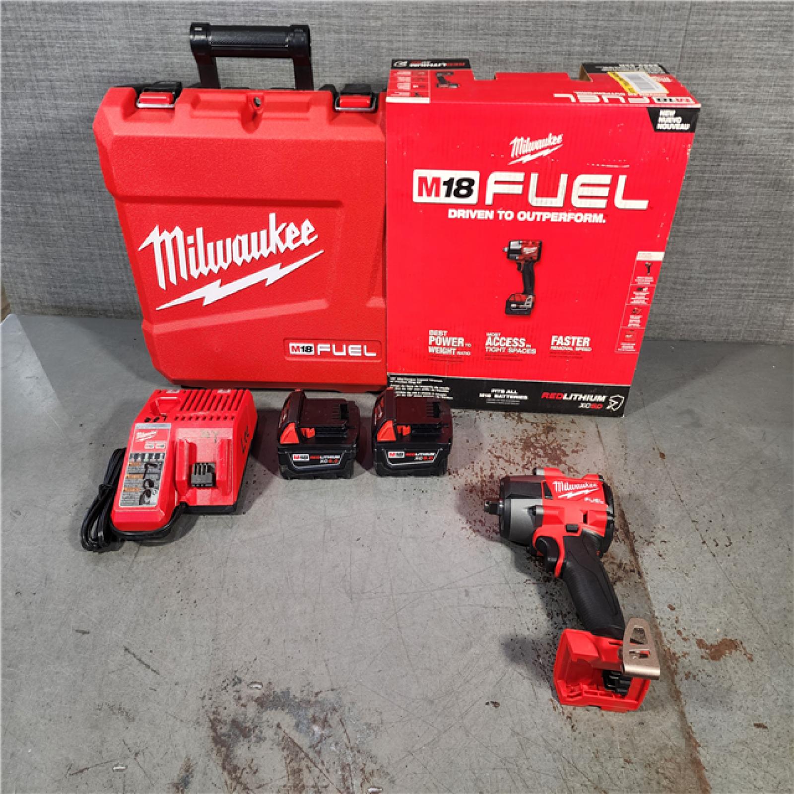 HOUSTON LOCATION - AS-IS (APPEARS LIKE NEW) Milwaukee M18 FUEL 1/2 in. Cordless Brushless Mid-Torque Impact Wrench Kit (Battery & Charger)