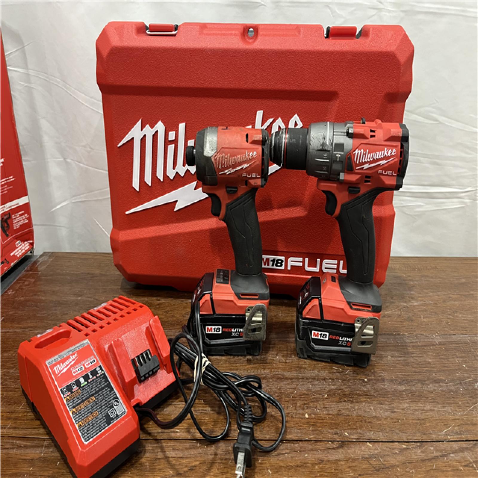 AS-IS Milwaukee M18 FUEL 18V Lithium-Ion Brushless Cordless Hammer Drill and Impact Driver Combo Kit (2-Tool) with 2 Batteries