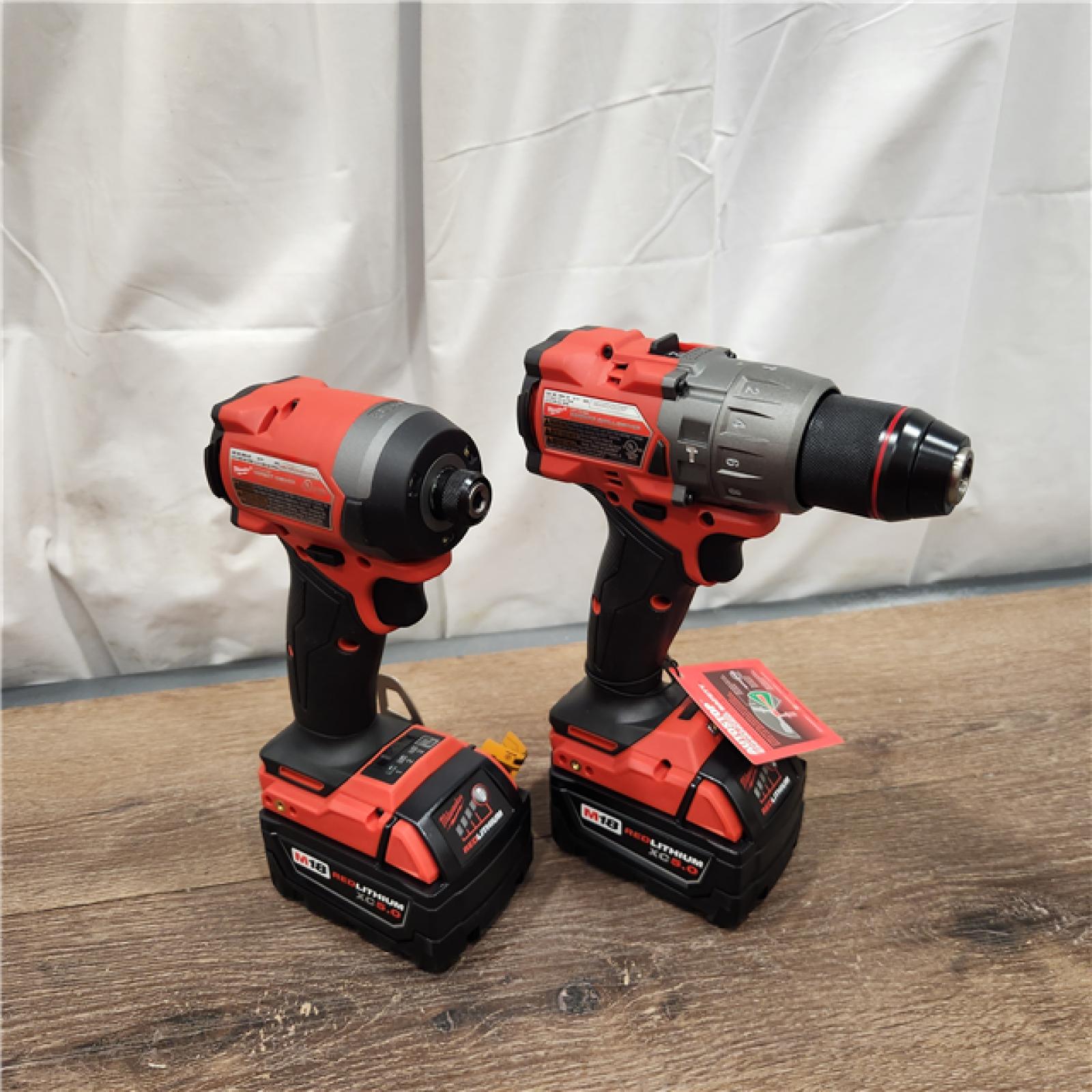 AS-IS Milwaukee M18 FUEL 18V Lithium-Ion Brushless Cordless Hammer Drill and Impact Driver Combo Kit (2-Tool) with 2 Batteries