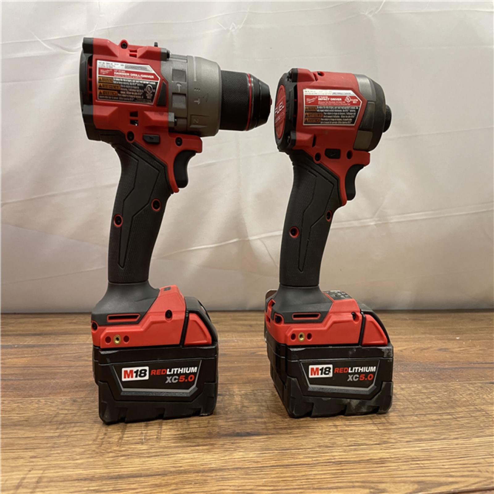 AS-IS MILWAUKEE M18 FUEL 18V Lithium-Ion Brushless Cordless Hammer Drill and Impact Driver Combo Kit (2-Tool) with 2 Batteries