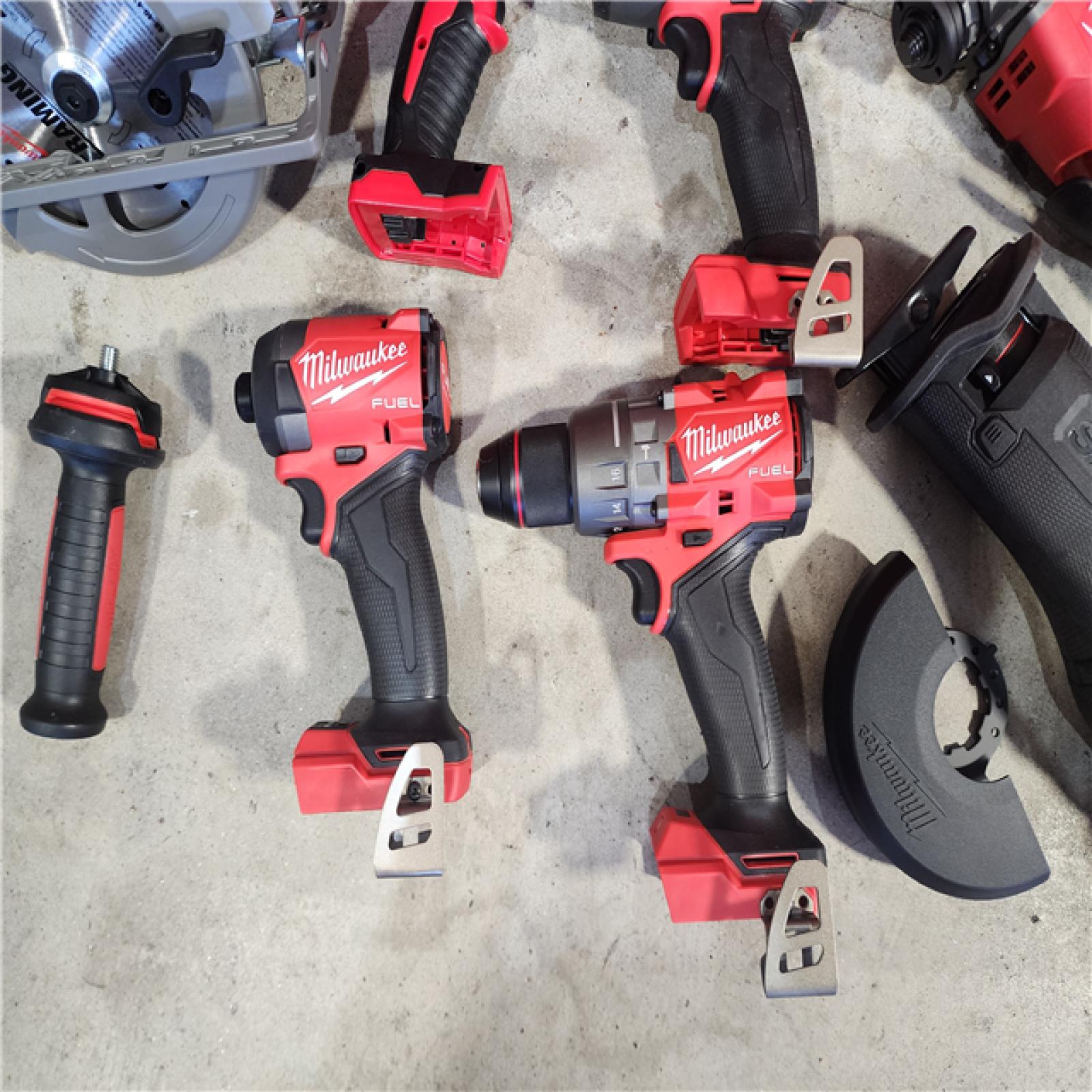 HOUSTON LOCATION - AS-IS (APPEARS LIKE NEW) Milwaukee M18 FUEL 18V Lithium-Ion Brushless Cordless Combo Kit with Two 5.0 Ah Batteries  1 Charger  2 Tool Bags (7-Tool)