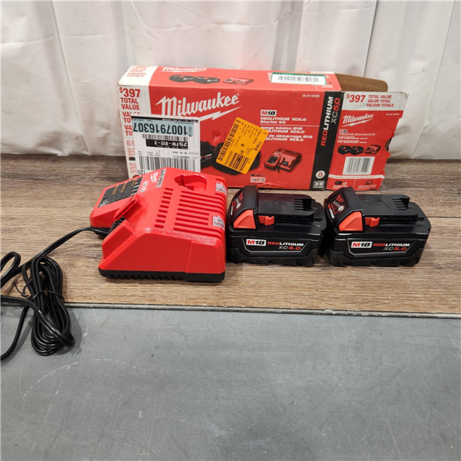 AS IS M18 18-Volt Lithium-Ion XC Starter Kit with Two 5.0Ah Batteries and Charger