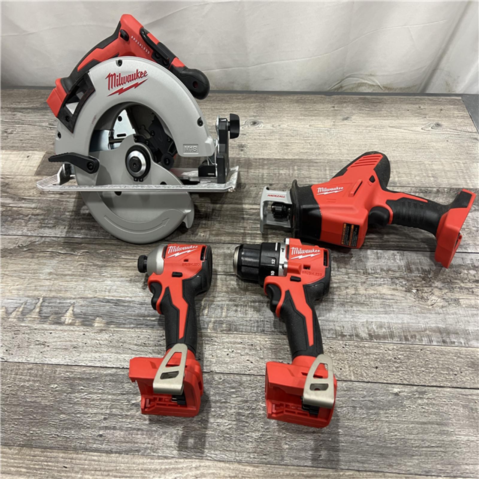 AS-IS Milwaukee M18 18-Volt Lithium-Ion Brushless Cordless Combo Kit (4-Tool) with 2-Batteries, 1-Charger and Tool Bag