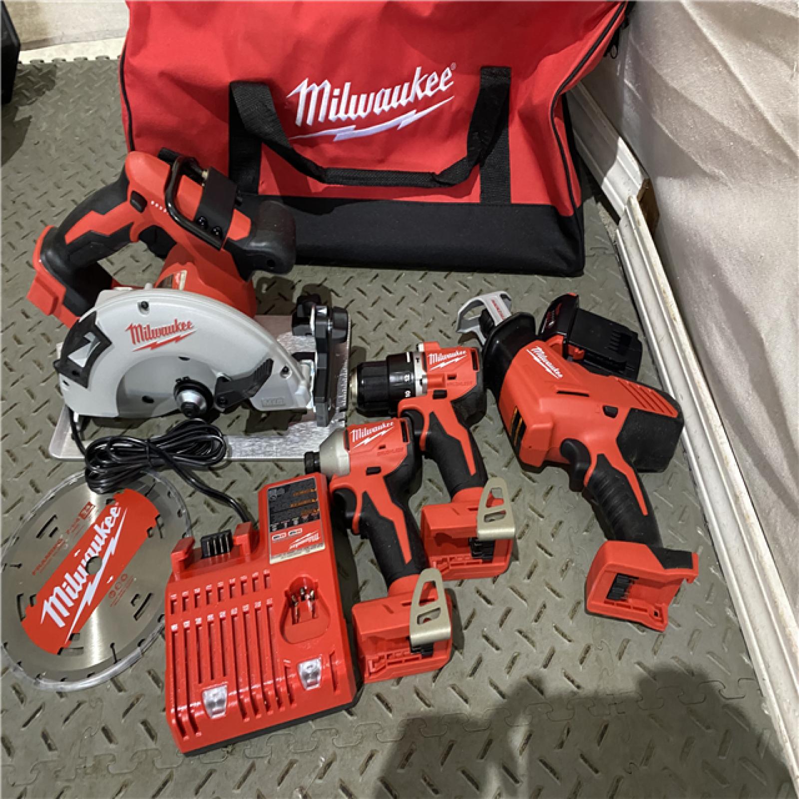 Houston location AS-IS MILWAUKEE M18 18-Volt Lithium-Ion Brushless Cordless Combo Kit (4-Tool) with  1-Charger and Tool Bag MISSING 1 BATTERY