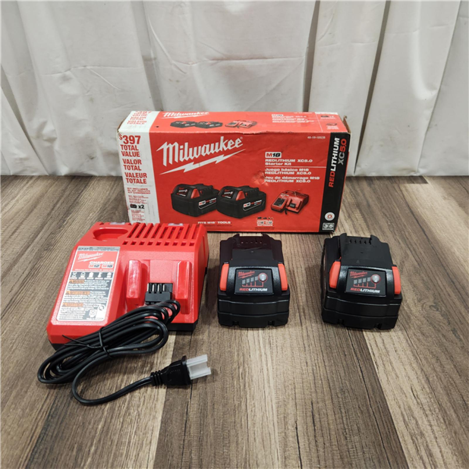 AS IS M18 18-Volt Lithium-Ion XC Starter Kit with Two 5.0Ah Batteries and Charger