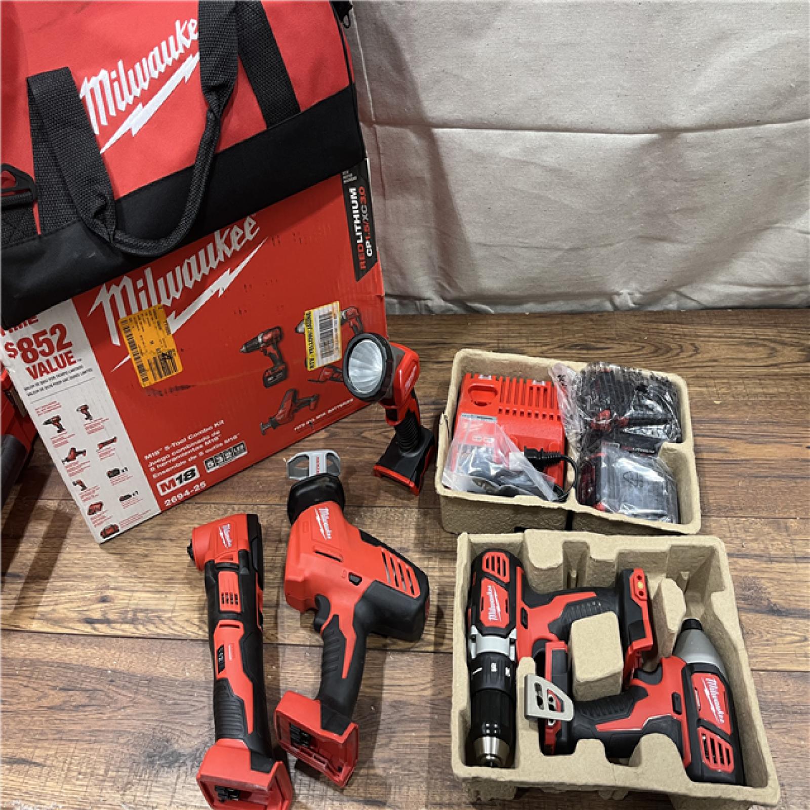 AS-IS Milwaukee M18 18V Lithium-Ion Cordless Combo Kit (5-Tool) with (2) Batteries, Charger and Tool Bag