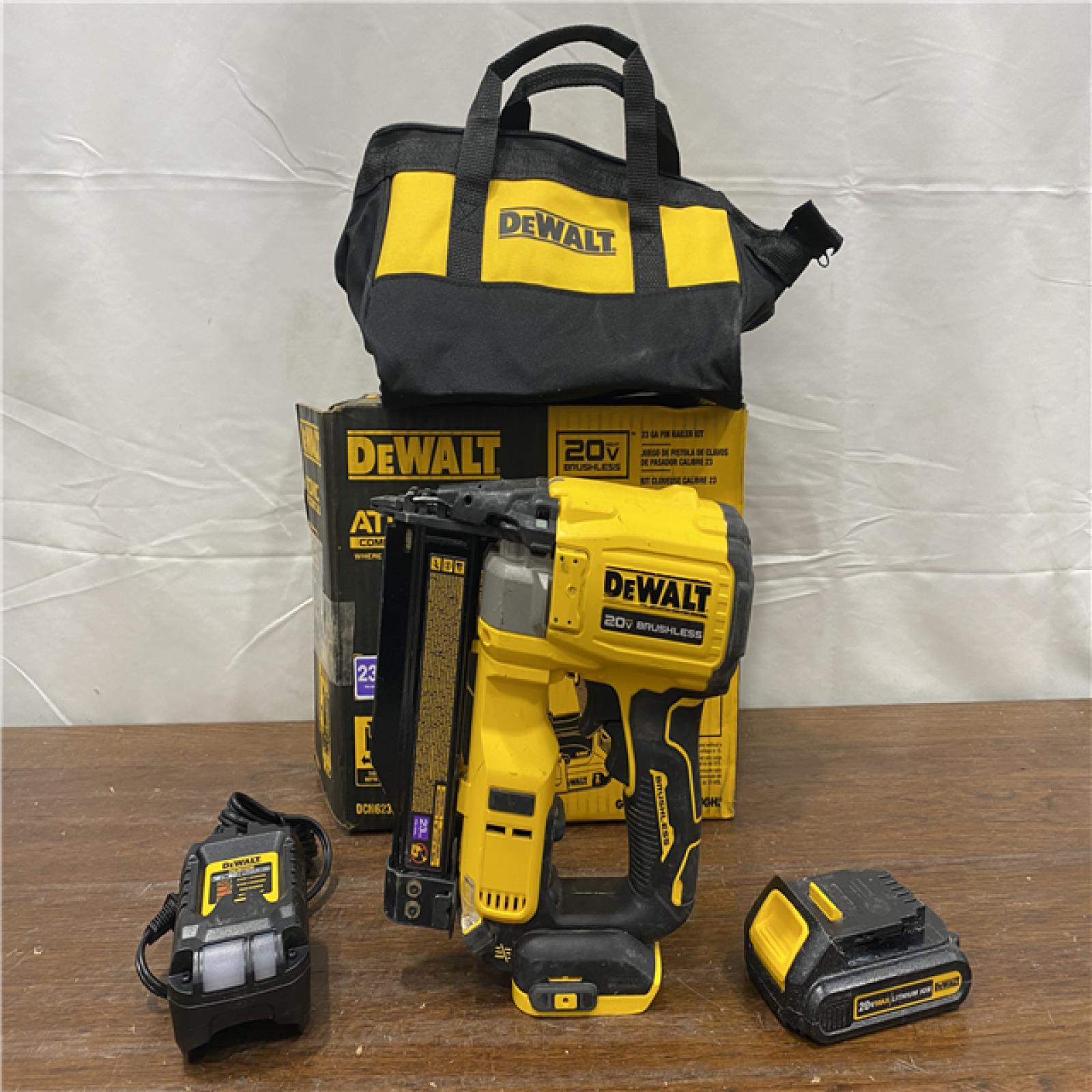 AS-IS DEWALT ATOMIC 20V MAX Lithium Ion Cordless 23 Gauge Pin Nailer Kit with 3.0Ah Battery and Charger