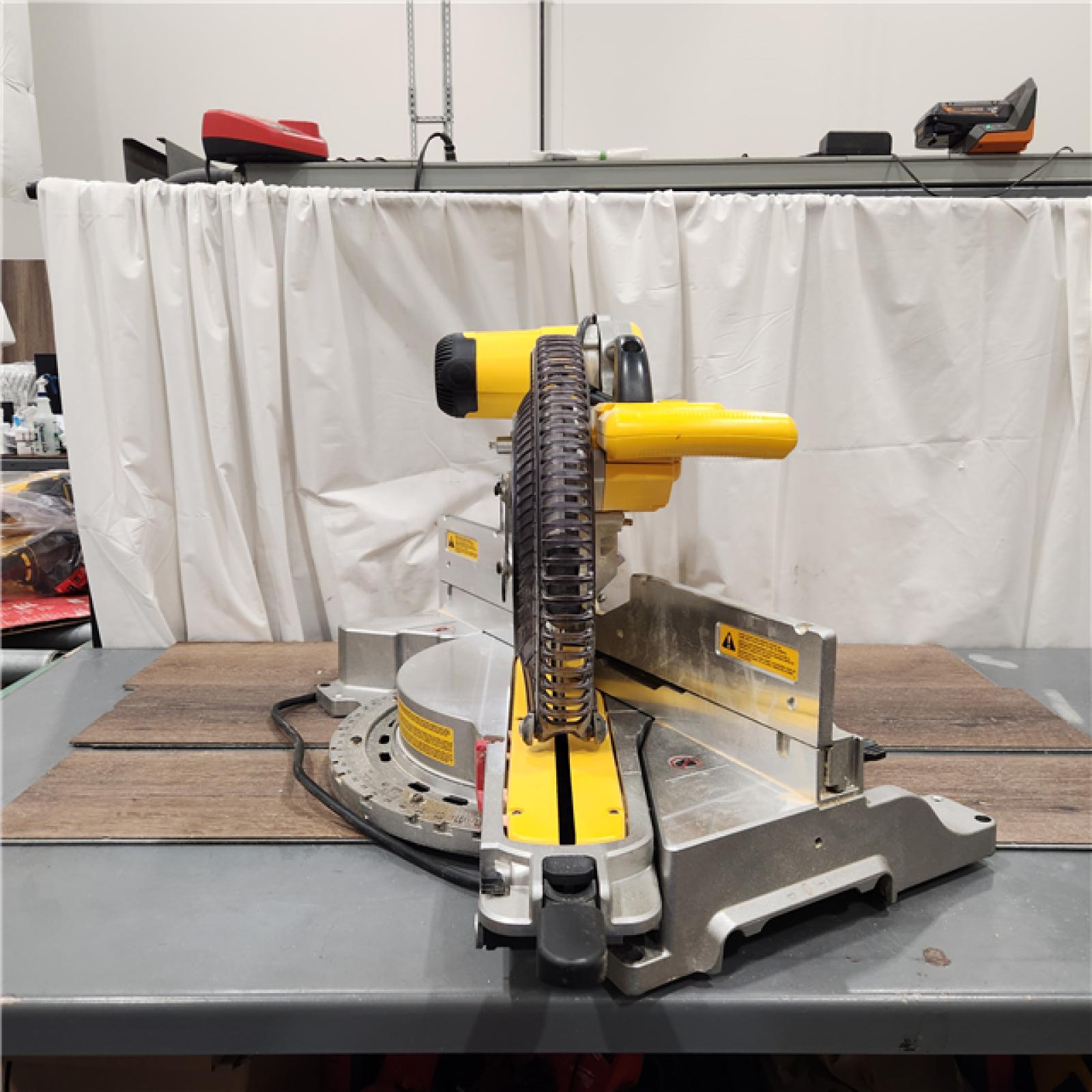 AS IS DEWALT 15 Amp Corded 12 in. Double Bevel Sliding Compound Miter Saw with XPS Technology, Blade Wrench and Material Clamp