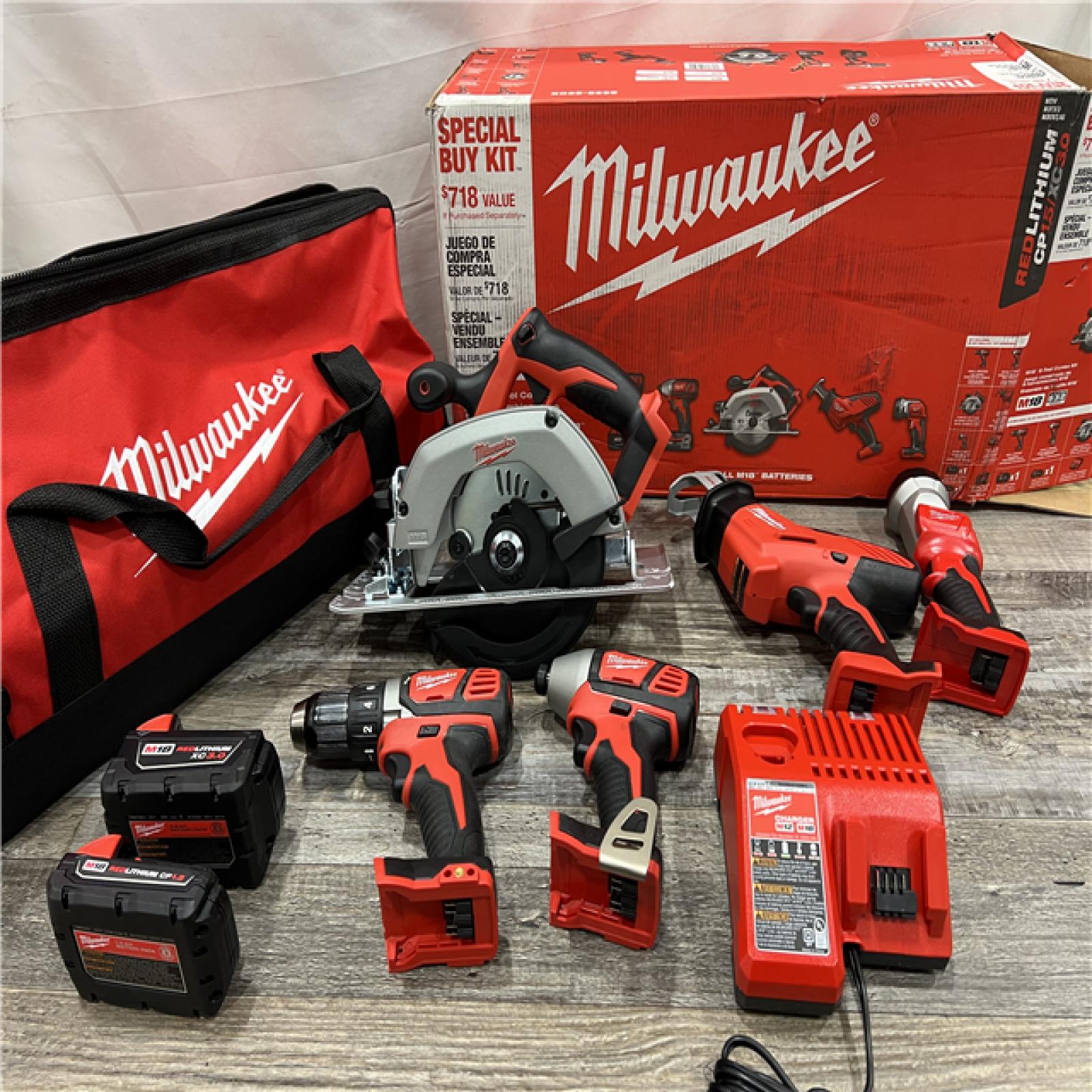 AS-IS MILWAUKEE M18 18V Lithium-Ion Cordless Combo Kit (5-Tool) with (1) 3.0Ah and (1) 1.5Ah Battery, (1) Charger, (1) Tool Bag