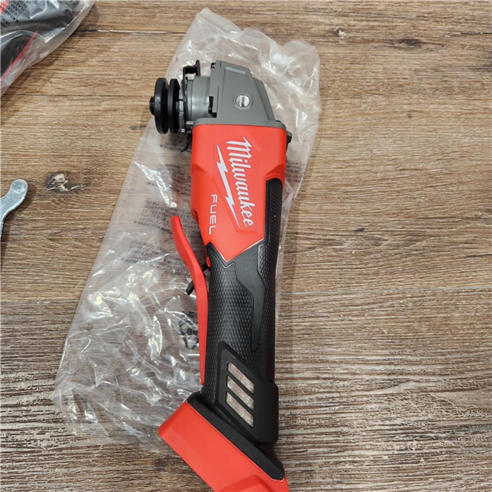 AS-IS Milwaukee 2880-20 M18 FUEL 18-Volt Lithium-Ion Brushless Cordless 4-1/2 in./5 in. Grinder W/Paddle Switch (Tool-Only)