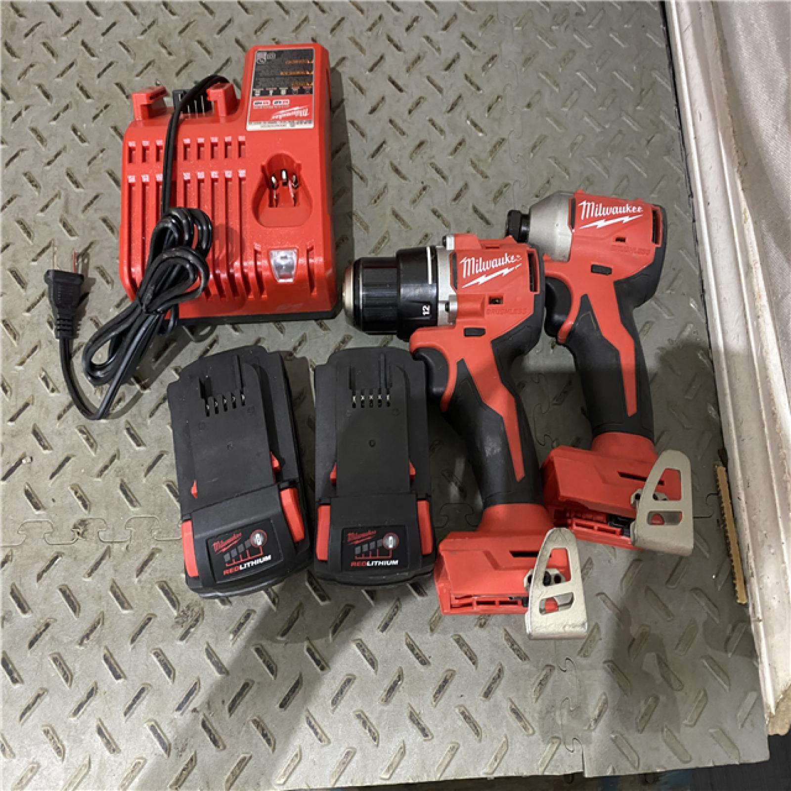 Houston location AS-IS MILWAUKEE M18 18V Lithium-Ion Brushless Cordless Compact Drill/Impact Combo Kit (2-Tool) W/(2) 2.0 Ah Batteries, Charger & Bag