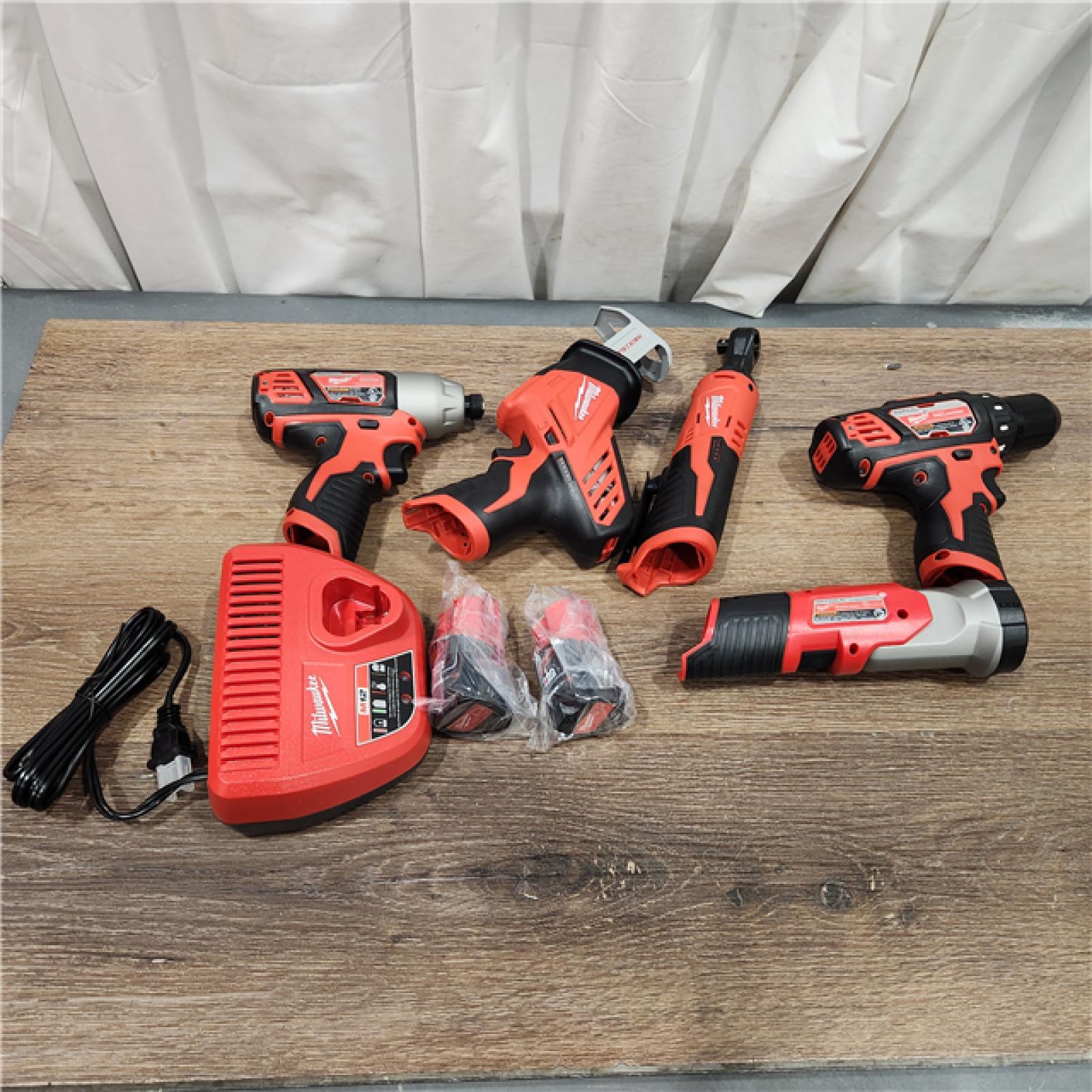 AS-IS MILWAUKEE M12 12V Lithium-Ion Cordless Combo Kit (5-Tool) with Two 1.5Ah Batteries, Charger & Tool Bag