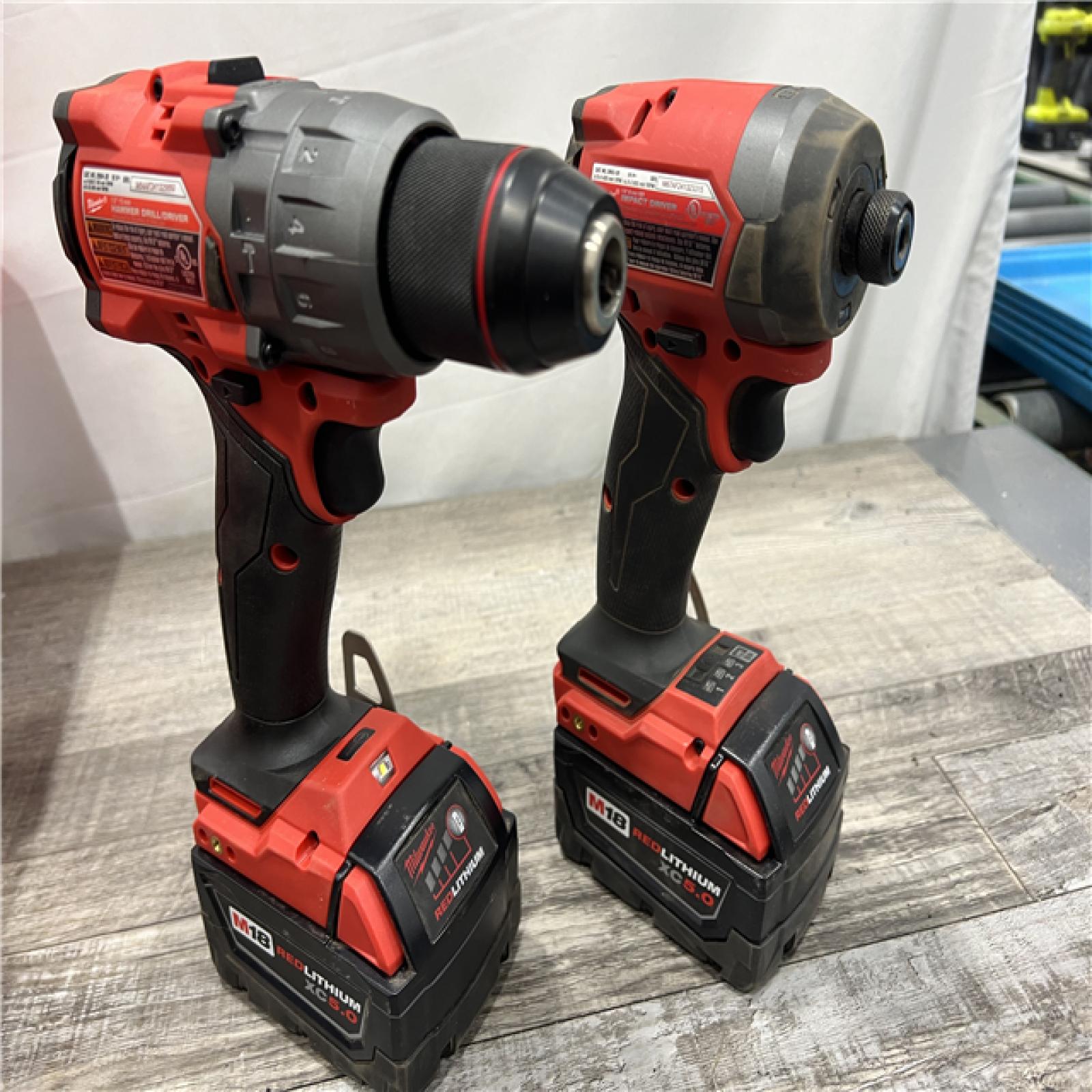 AS-IS MILWAUKEE M18 FUEL 18V Lithium-Ion Brushless Cordless Hammer Drill and Impact Driver Combo Kit (2-Tool) with 2 Batteries