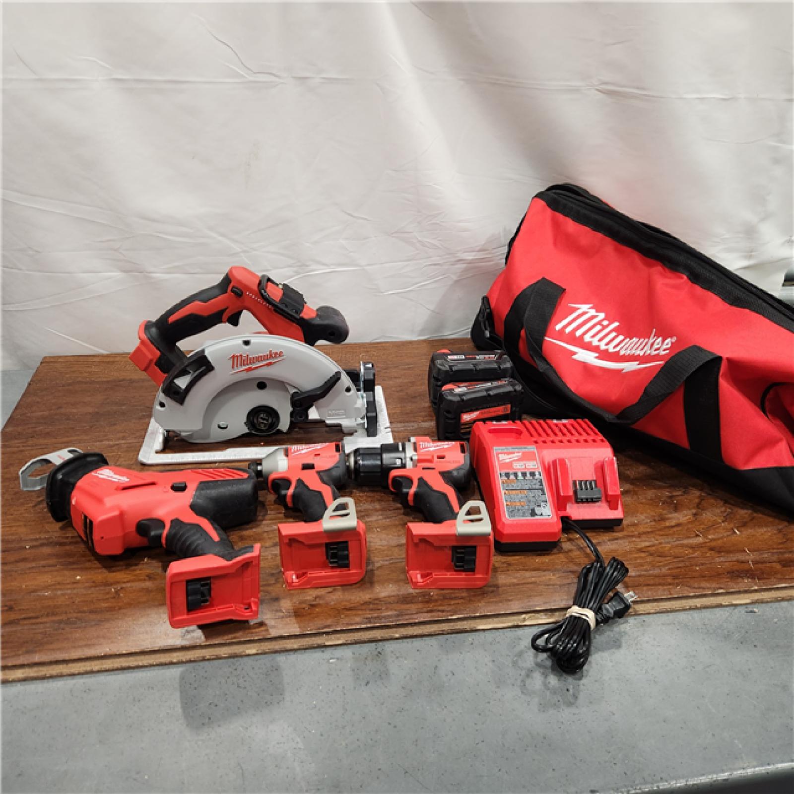 AS-IS Milwaukee M18 18-Volt Lithium-Ion Brushless Cordless Combo Kit (4-Tool) with 2-Batteries, 1-Charger and Tool Bag