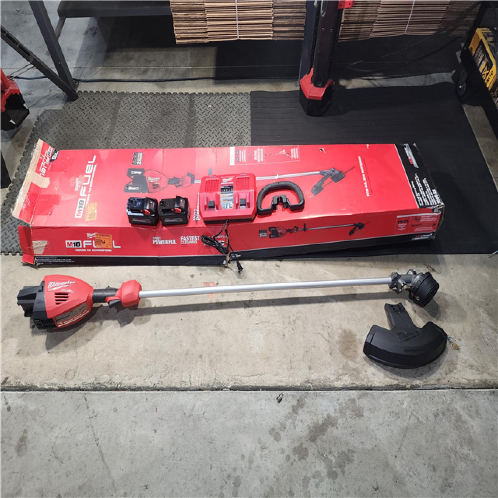 HOUSTON LOCATION - AS-IS (APPEARS LIKE NEW) Milwaukee M18 FUEL 18V Brushless Cordless 17 in. Dual Battery Straight Shaft String Trimmer Kit