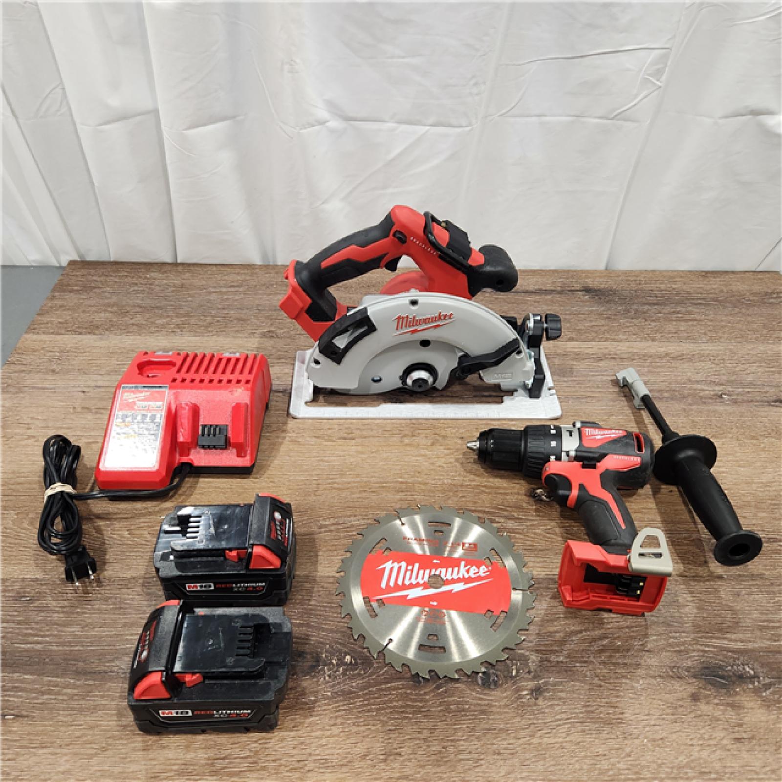 AS-IS M18 18V Lithium-Ion Brushless Cordless Hammer Drill and Circular Saw Combo Kit (2-Tool) with Two 4.0 Ah Batteries