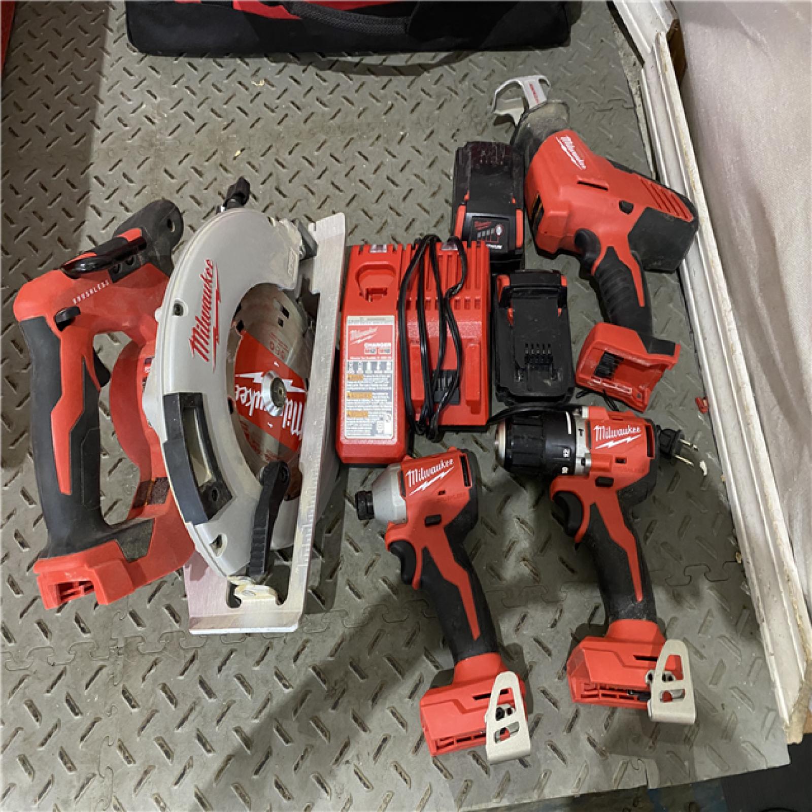 Houston location AS-IS MILWUKEE M18 18-Volt Lithium-Ion Brushless Cordless Combo Kit (4-Tool) with 2-Batteries, 1-Charger and Tool Bag