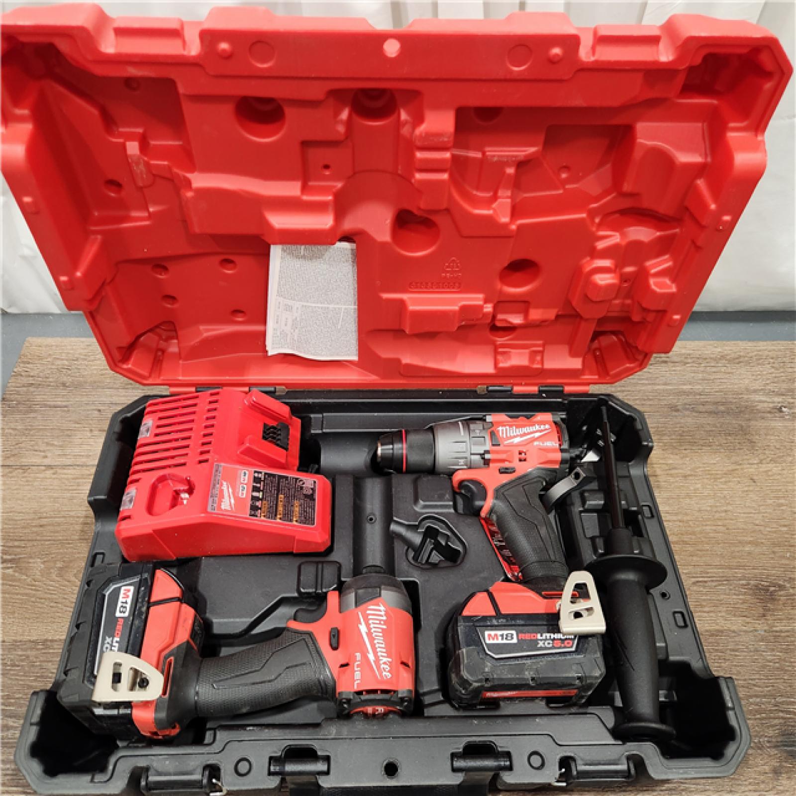 AS-IS Milwaukee M18 FUEL 18V Lithium-Ion Brushless Cordless Hammer Drill and Impact Driver Combo Kit (2-Tool) with 2 Batteries