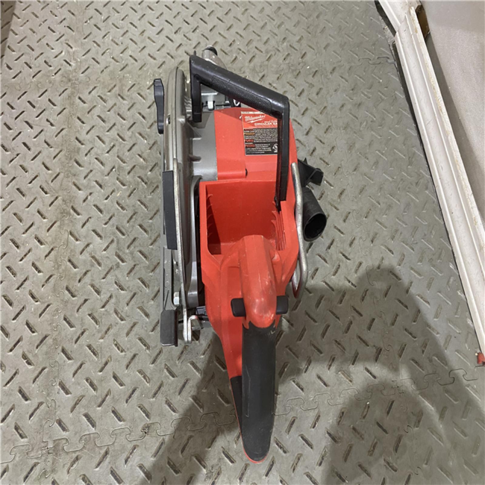 Houston location AS-IS  Milwaukee 2830-20 Rear Handle Circular Saw M18 FUEL 7-1/4  Cordless Brushless Tool Only