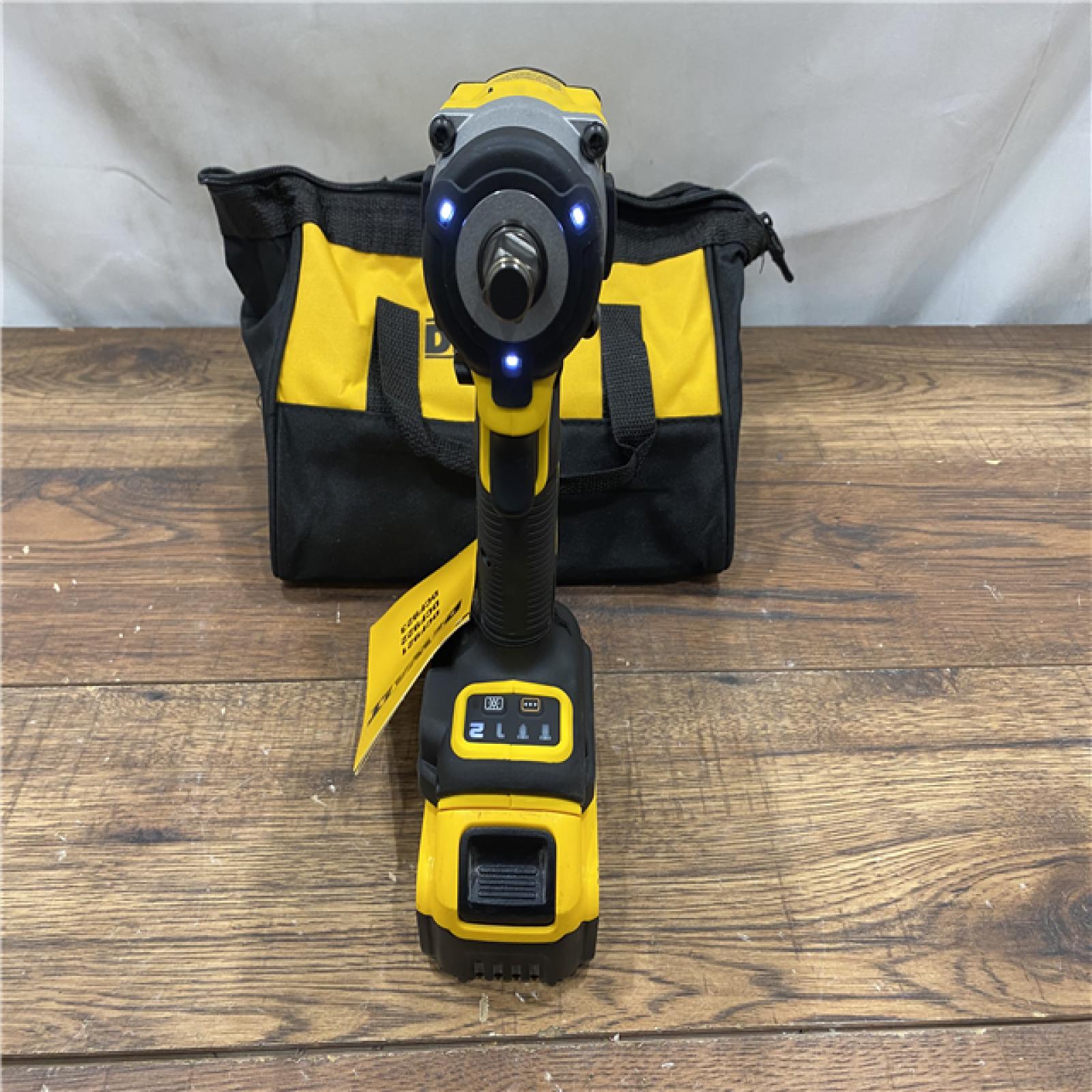 AS IS DEWALT ATOMIC 20V MAX Lithium-Ion Brushless Cordless 1/2 in. Variable Speed Impact Wrench Kit with 5 Ah Battery and Charger