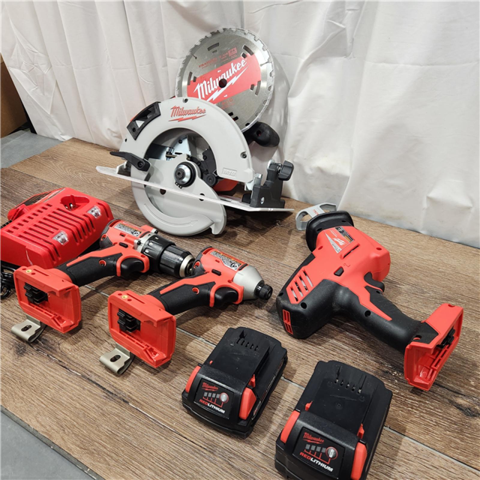 AS-IS Milwaukee M18 18-Volt Lithium-Ion Brushless Cordless Combo Kit (4-Tool) with 2-Batteries, 1-Charger and Tool Bag