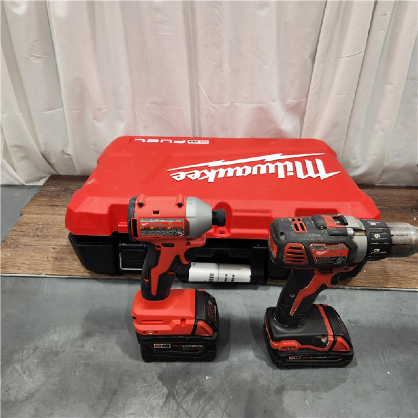 AS IS Milwaukee M18 FUEL 18V Lithium-Ion Brushless Cordless Hammer Drill and Impact Driver Combo Kit (2-Tool) with 2 Batteries