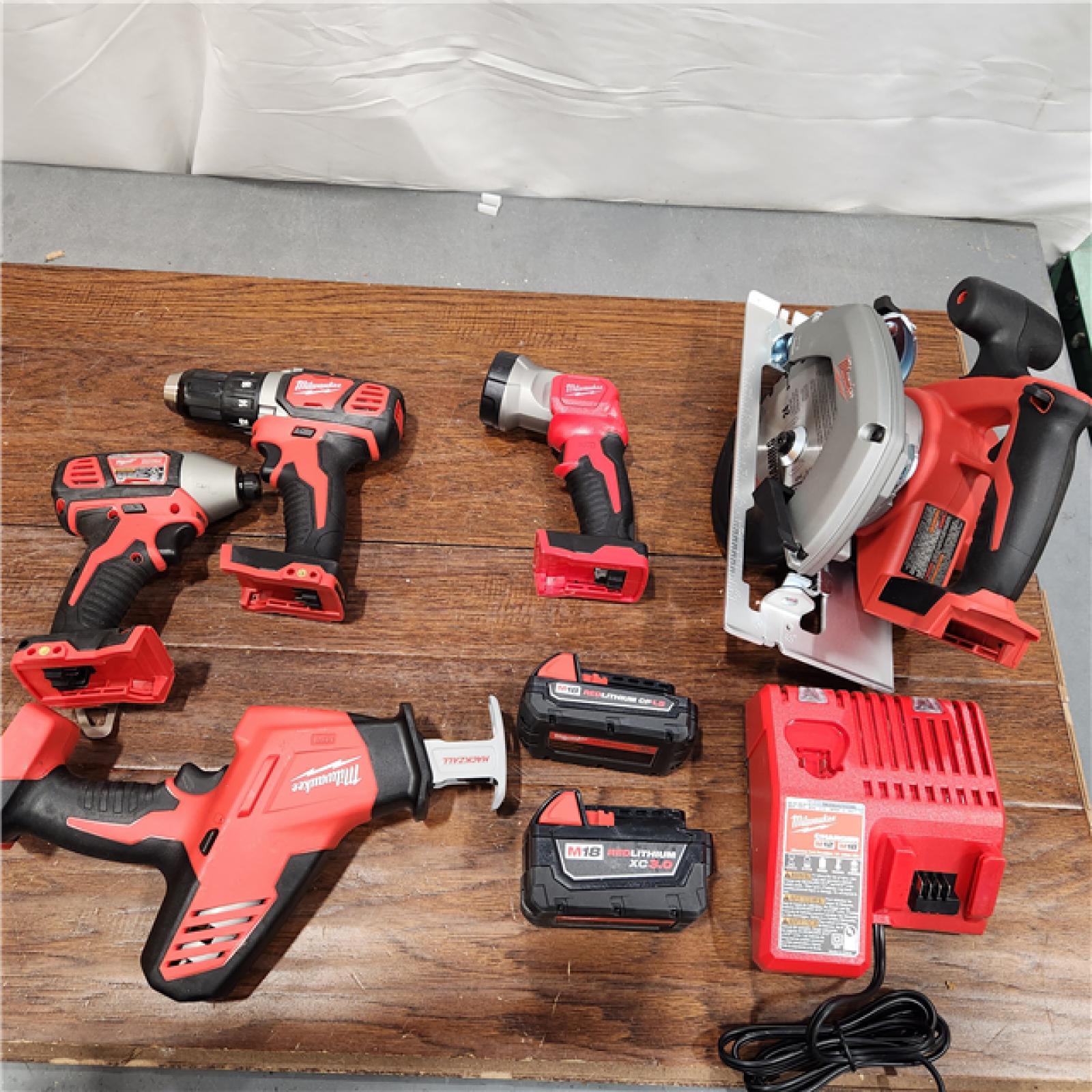 AS-IS Milwaukee M18 18-Volt Lithium-Ion Cordless Combo Tool Kit (5-Tool) with (1) 3.0Ah and (1) 1.5Ah Battery, (1) Charger, (1) Tool Bag