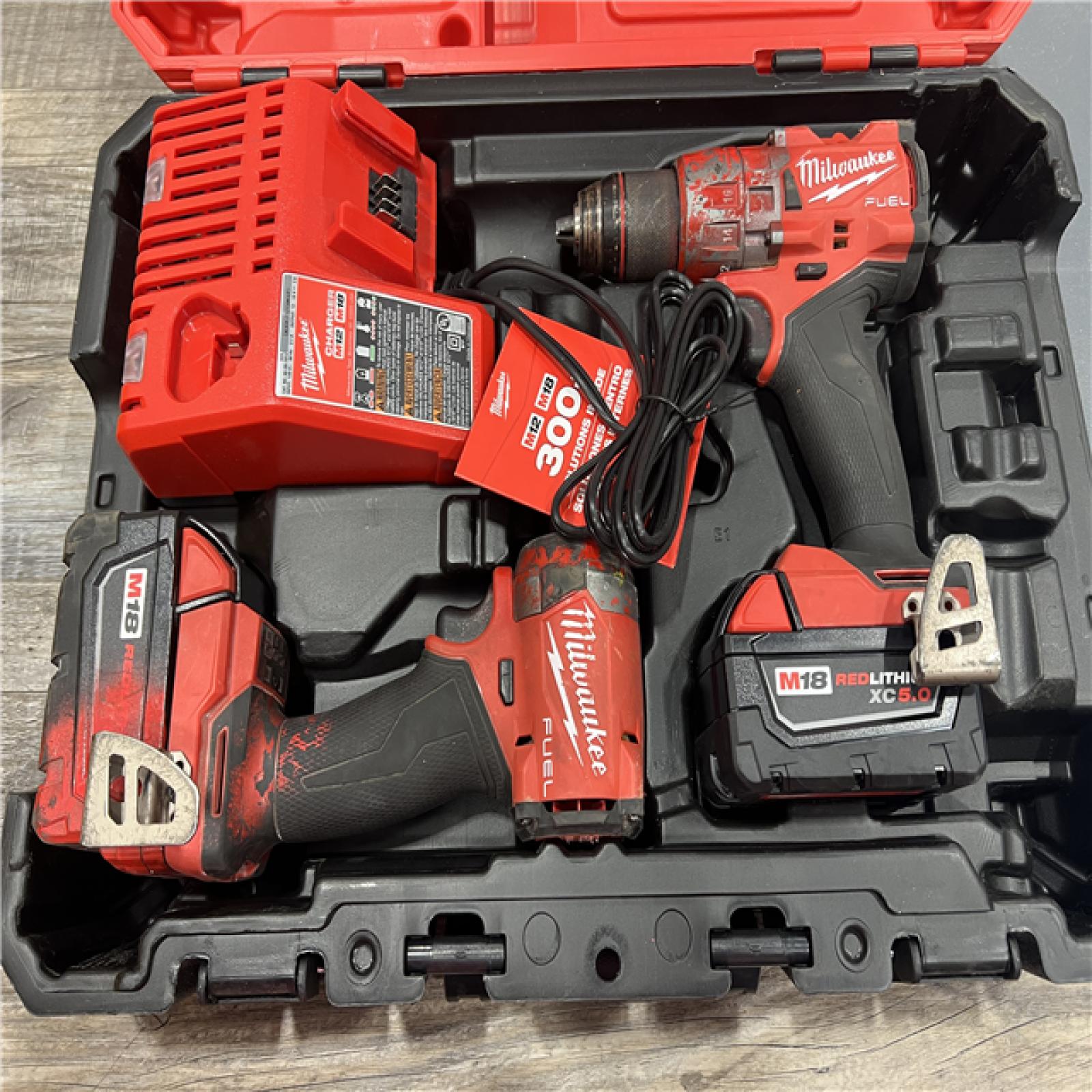 AS-IS MILWAUKEE M18 FUEL 18V Lithium-Ion Brushless Cordless Hammer Drill and Impact Driver Combo Kit (2-Tool) with 2 Batteries