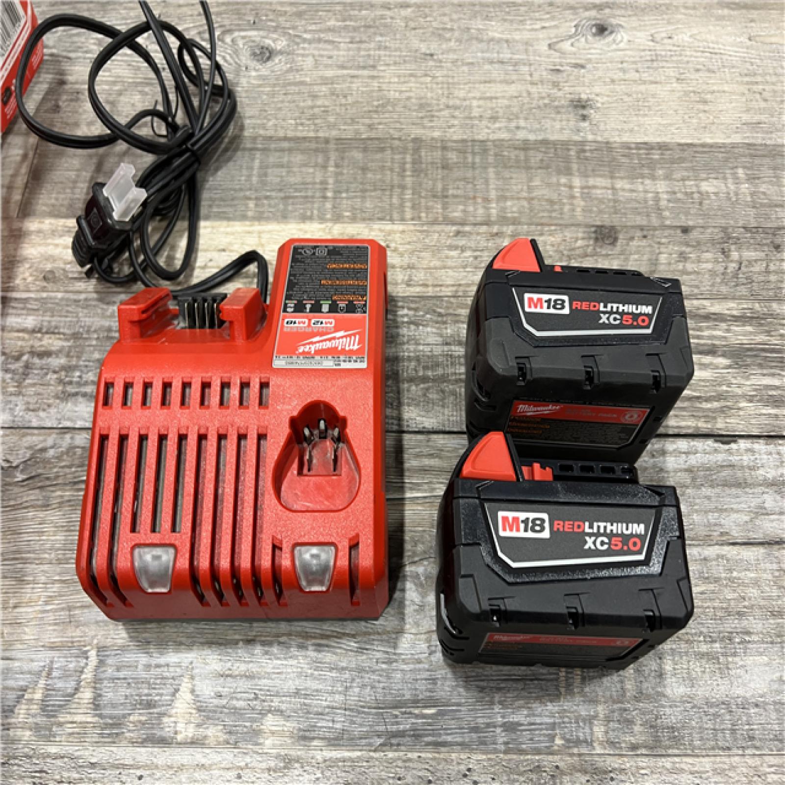 AS-IS Milwaukee M18 18-Volt Lithium-Ion XC Starter Kit with Two 5.0Ah Batteries / Charger (48-59-1852B)