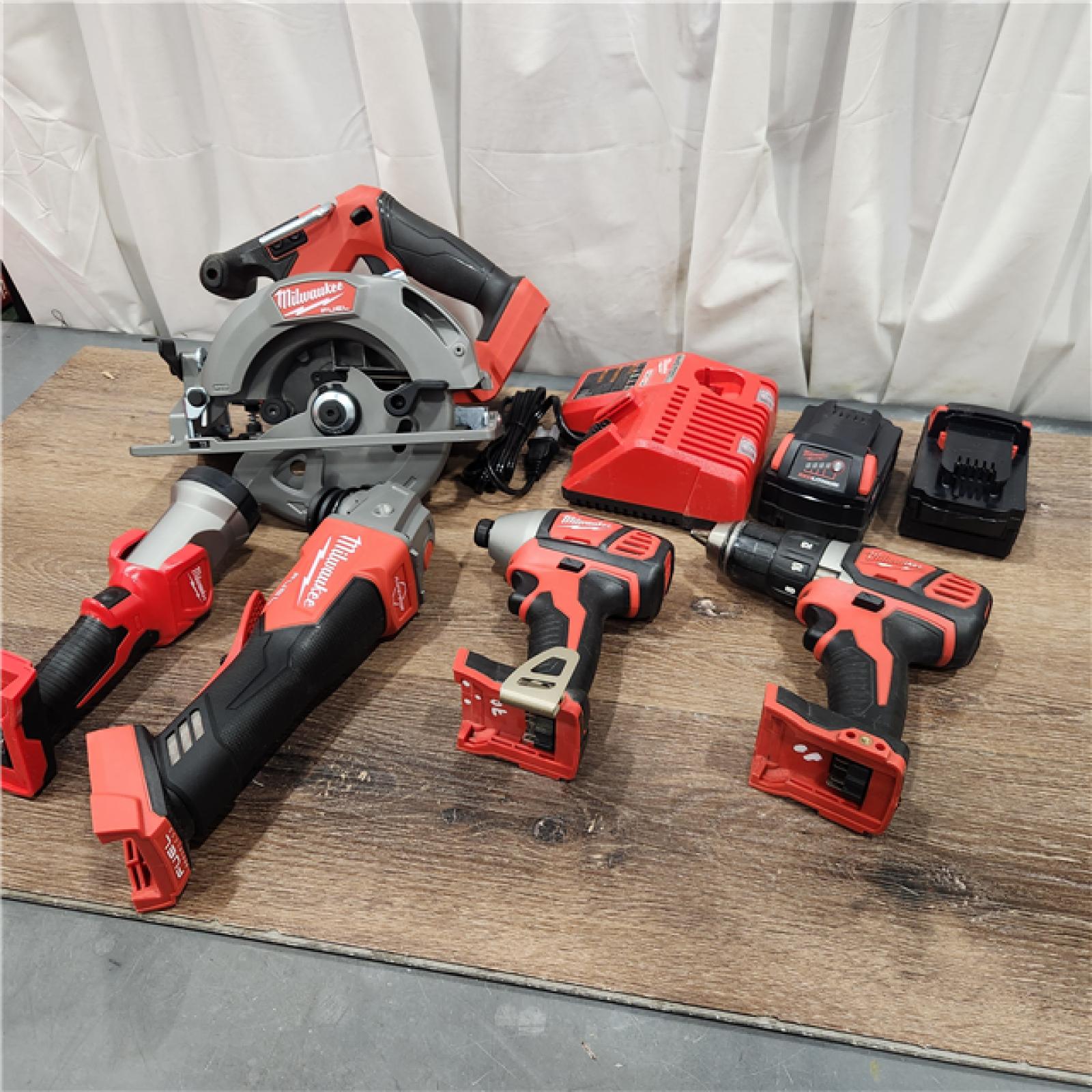 AS-IS M18 18-Volt Lithium-Ion Brushless Cordless FUEL Combo Kit (5-Tool) with 2-Batteries, 1-Charger, and Tool Bag