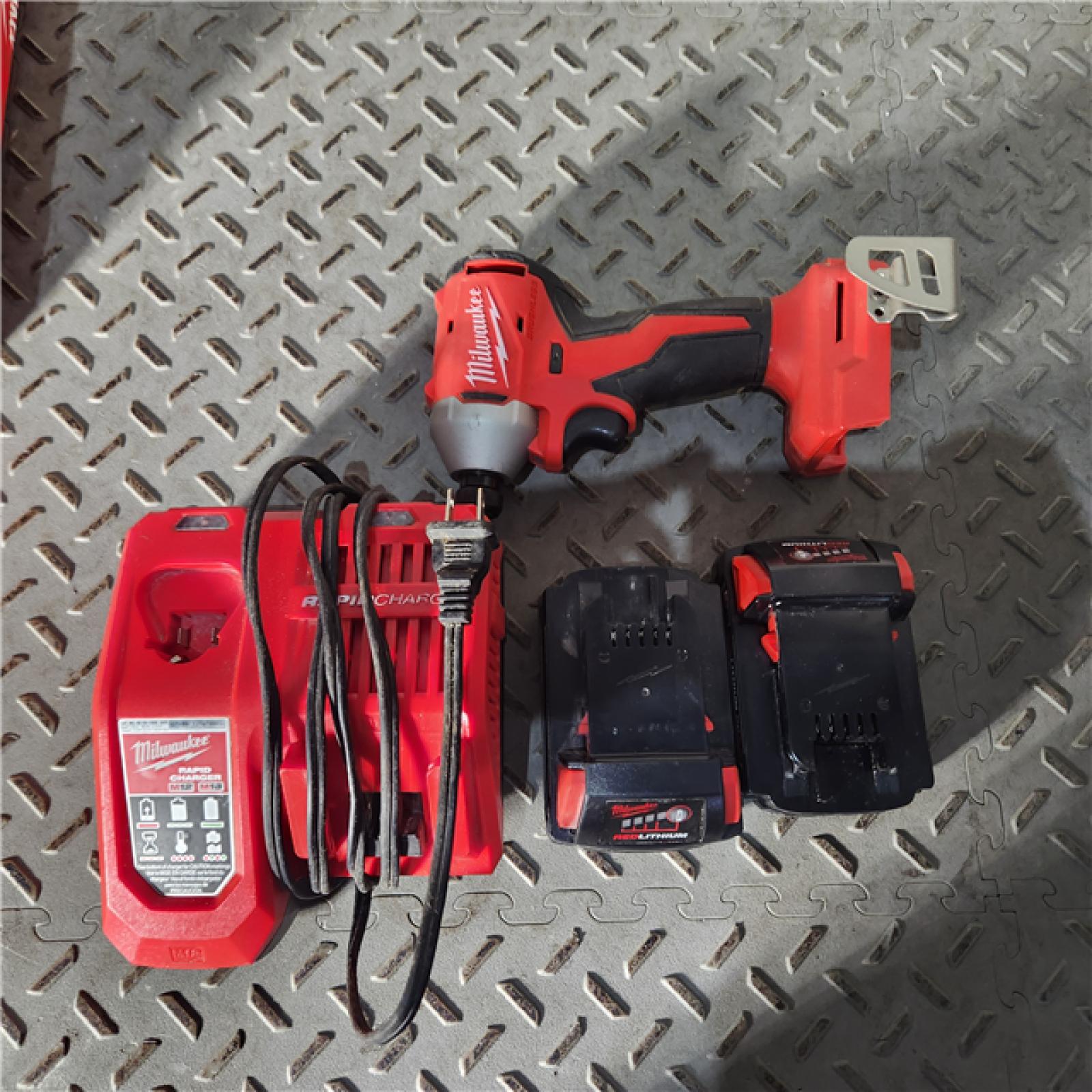 Houston location AS-IS Milwaukee M18 Compact Brushless 1/4  Hex Impact Driver Kit