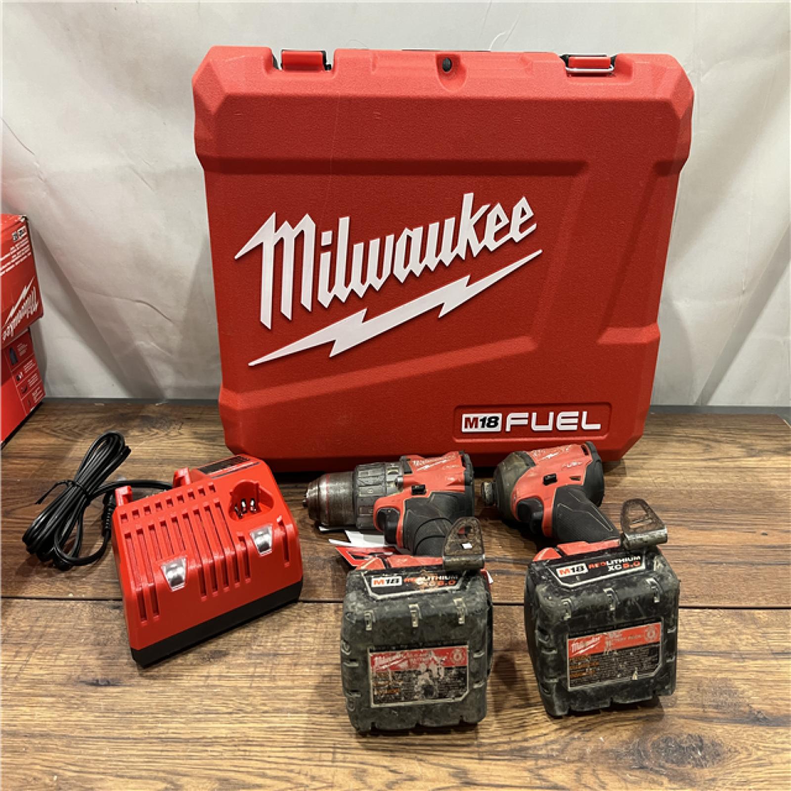 AS-IS Milwaukee M18 FUEL 18V Lithium-Ion Brushless Cordless Hammer Drill and Impact Driver Combo Kit (2-Tool) with 2 Batteries