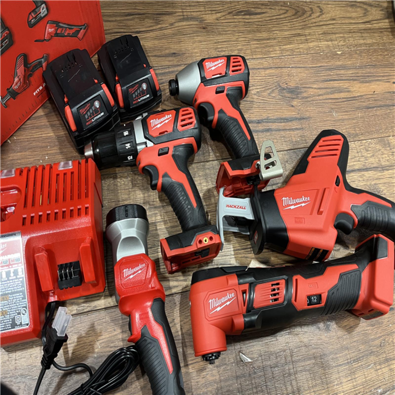 AS-IS Milwaukee M18 18V Lithium-Ion Cordless Combo Kit (5-Tool) with (2) Batteries, Charger and Tool Bag