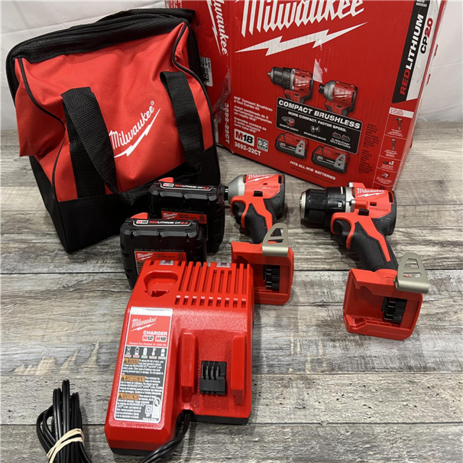 AS-IS MILWAUKEE M18 18V Lithium-Ion Brushless Cordless Compact Drill/Impact Combo Kit (2-Tool) W/(2) 2.0 Ah Batteries, Charger & Bag